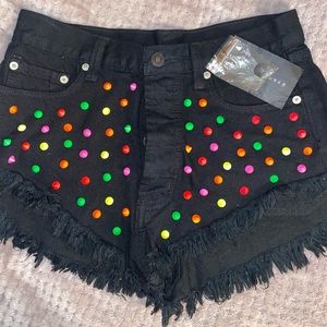 Black high waisted denim shorts with colored dots